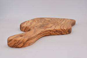 Tagliere grande irregolare con manico in legno d'ulivo