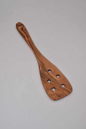 Spatula with holes in olive wood