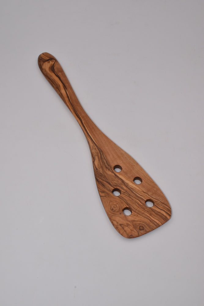 Spatula with holes in olive wood